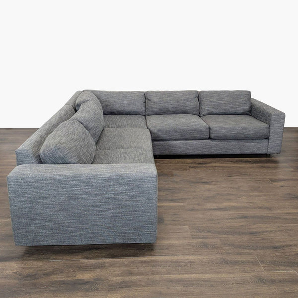 Modern gray West Elm sectional with clean lines, plush cushions, and spacious seating for living rooms.