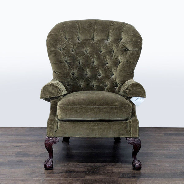 Thomasville lounge chair with tufted olive green upholstery, carved wood legs, and elegant claw feet.  
