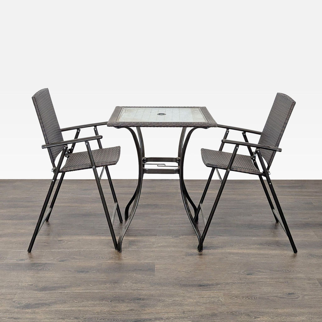 1. Outdoor set with a square glass table and two foldable wicker chairs on a wooden floor, metal frames visible.