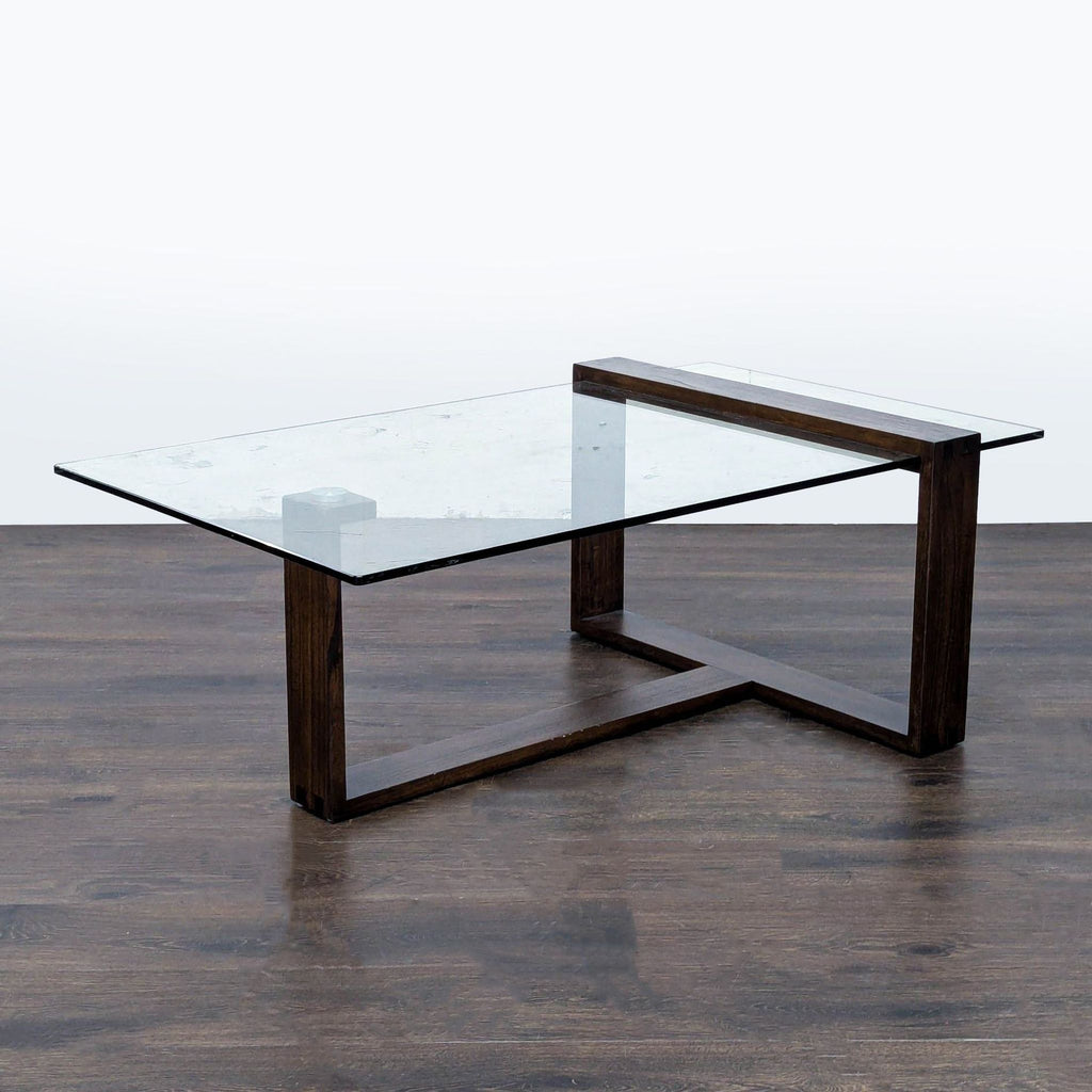3. Rectangular coffee table with tempered glass top and mindi wood base, mid-century modern, Living Spaces.
