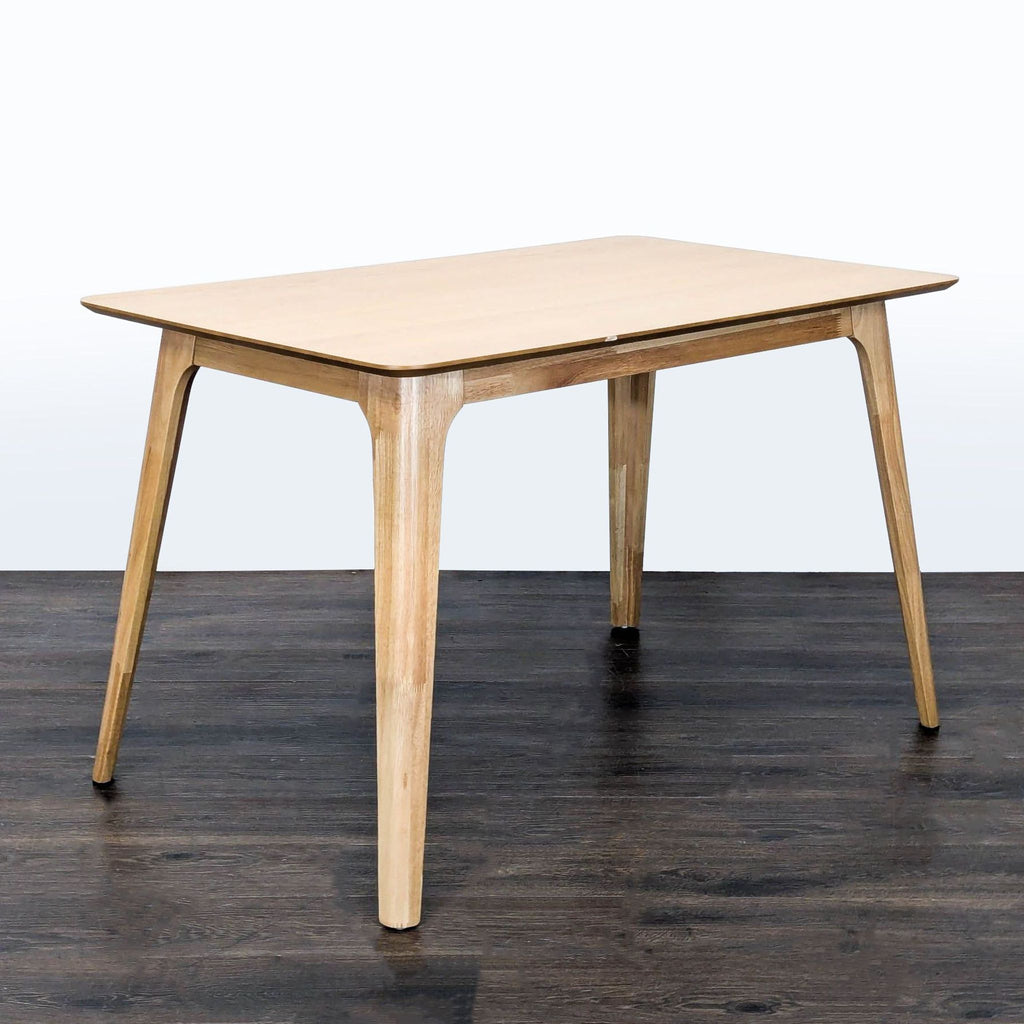 1. Rectangular dining table from Noble House for West Elm with a modern wood design.