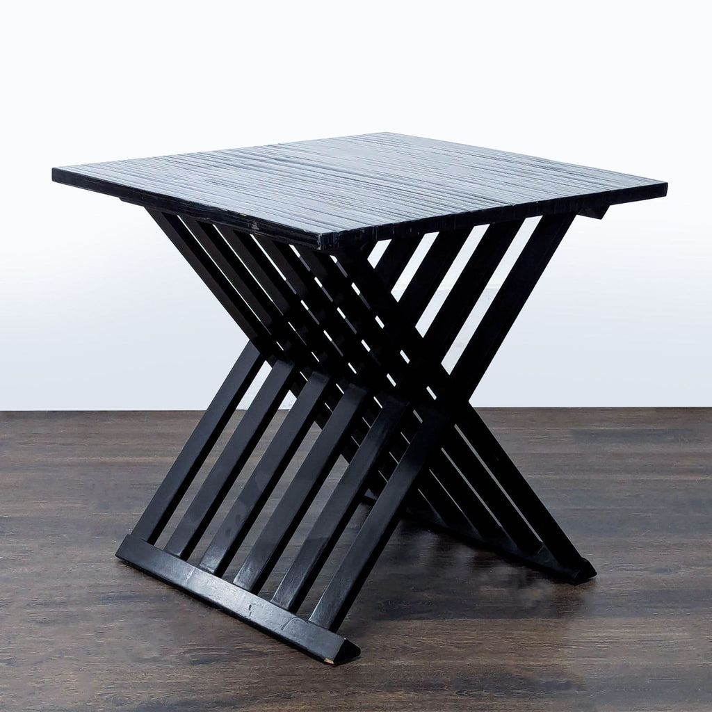 2. Ebonized end table featuring bamboo veneers, Gmelina wood, and a slatted X-leg design from Bernhardt Furniture.