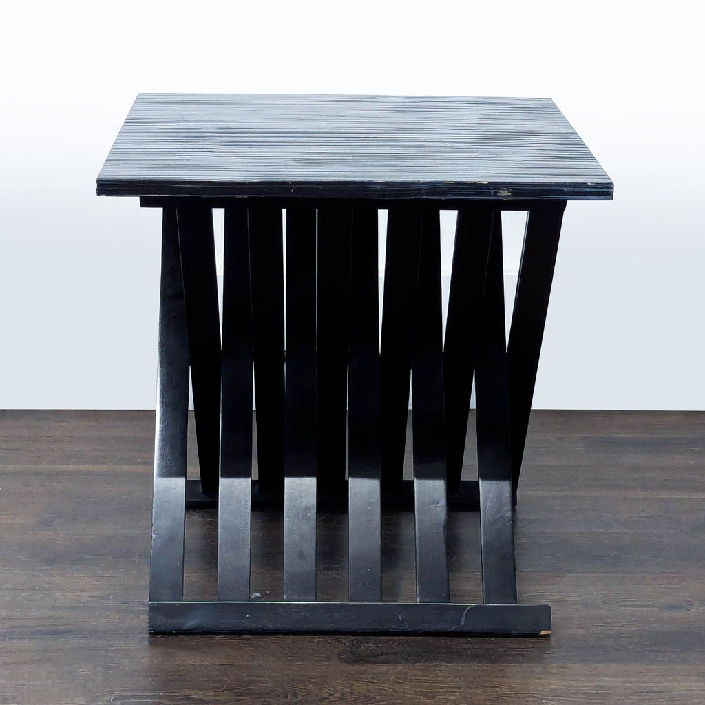3. High sheen black end table with slatted X base, crafted from bamboo and Gmelina wood by Bernhardt Furniture.