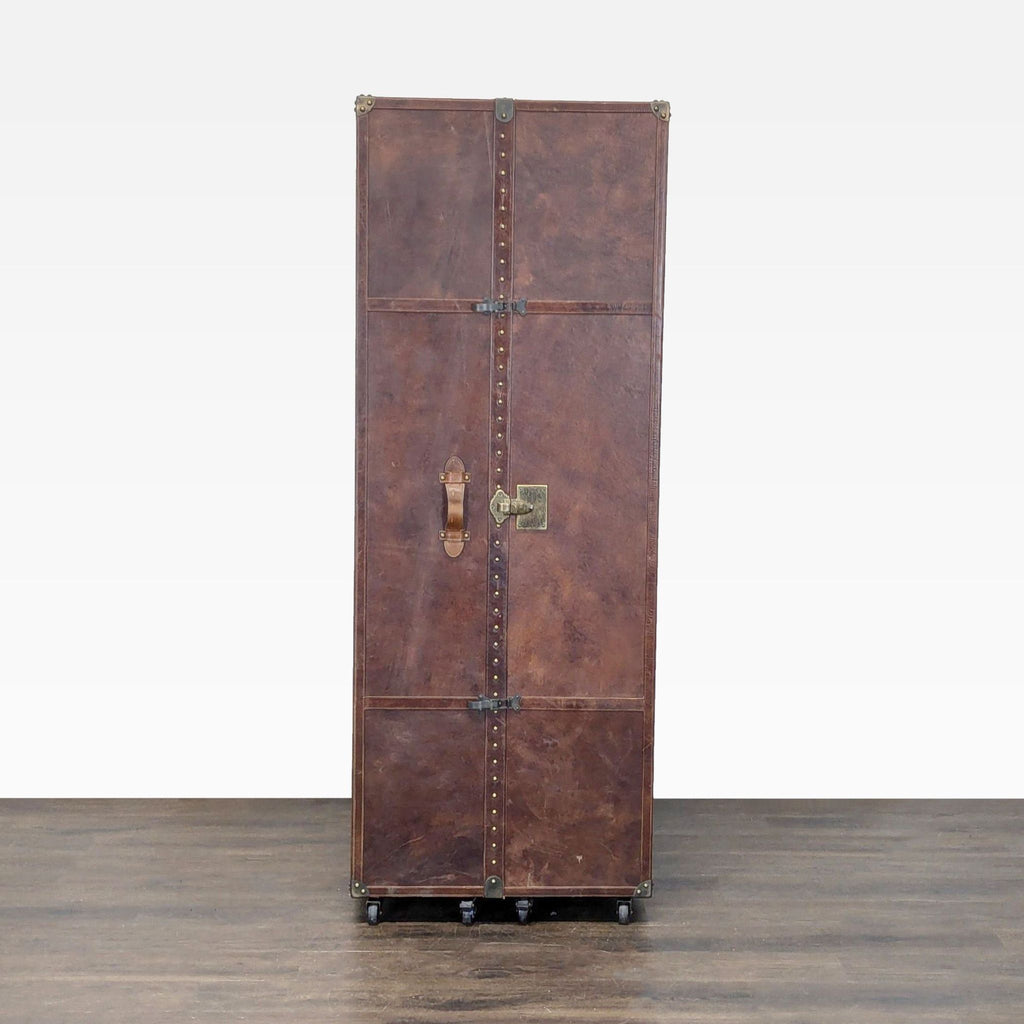Vintage-inspired Restoration Hardware office trunk with leather, brass accents, and versatile storage compartments.