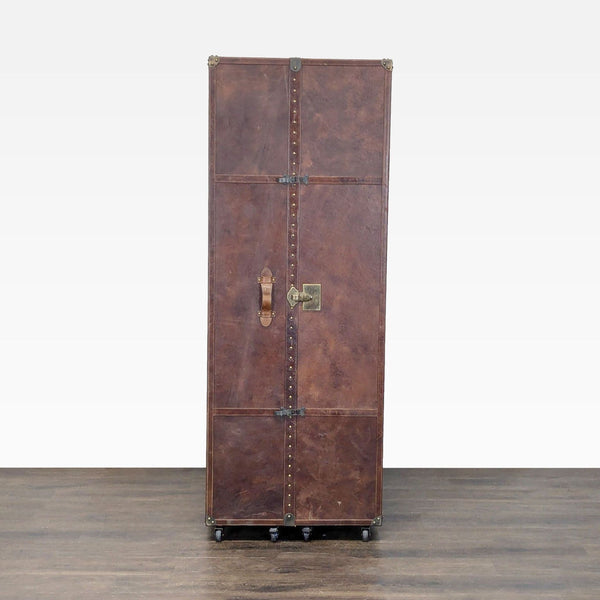 Vintage-inspired Restoration Hardware office trunk with leather, brass accents, and versatile storage compartments.