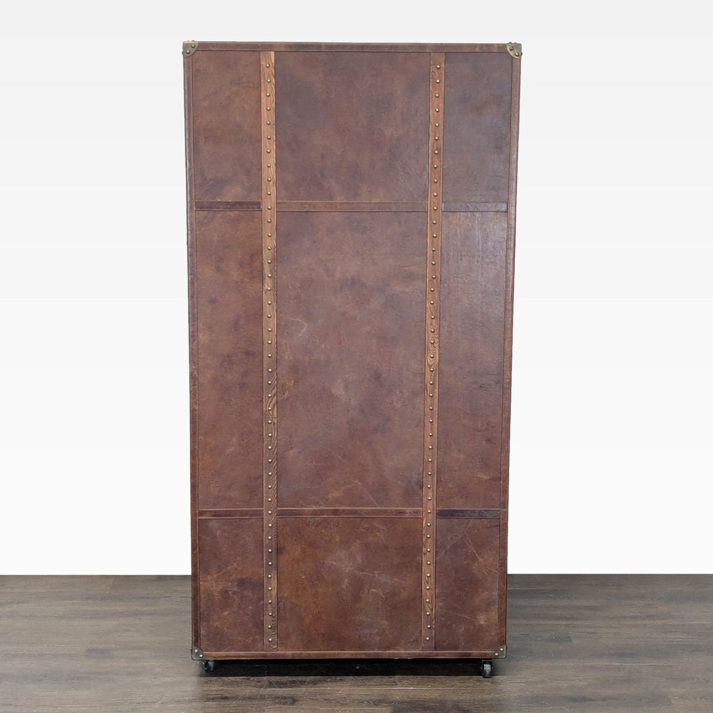 Classic office trunk by Restoration Hardware, featuring sturdy leather, brass details, drawers, and shelves for storage.