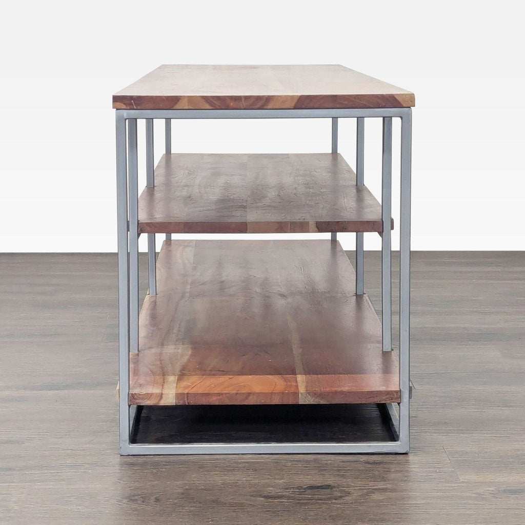 3. Acacia wood and metal three-tier stand from CB2, ideal for serving or organizing.