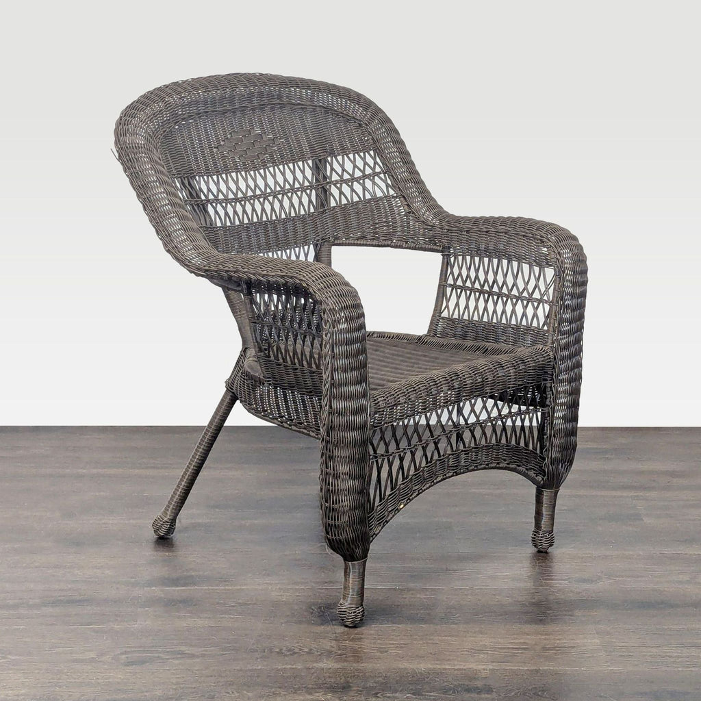 Classic brown wicker patio chair featuring sturdy, supportive weaving and elegant armrests for comfort.  