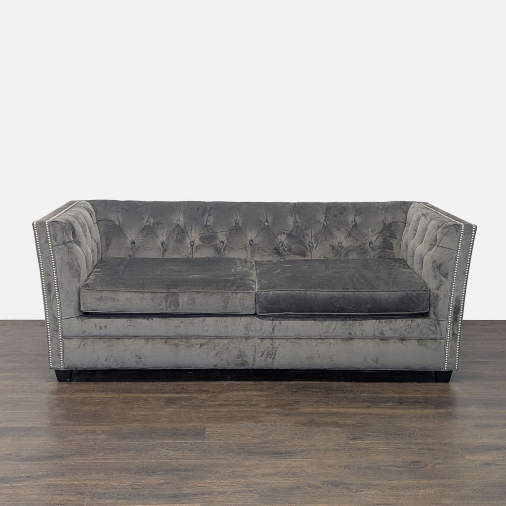 Gray velvet sleeper sofa with tufted back and nailhead trim, by Mitchell Gold + Bob Williams.