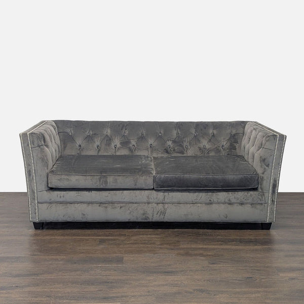 Gray velvet sleeper sofa with tufted back and nailhead trim, by Mitchell Gold + Bob Williams.