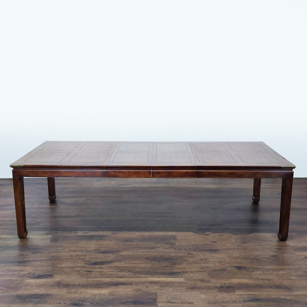 Dining table featuring two leaves for adjustable width, extending up to 100 inches.  