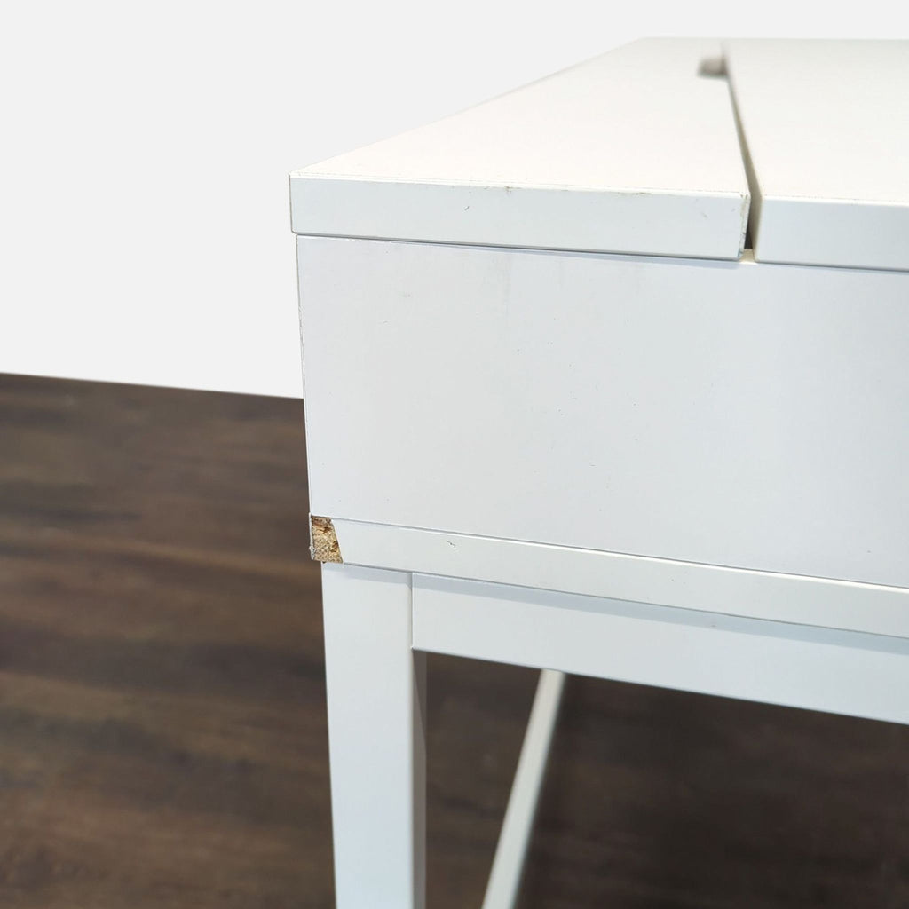 Contemporary desk in white with metal frame, offering extra storage and a clutter-free design.