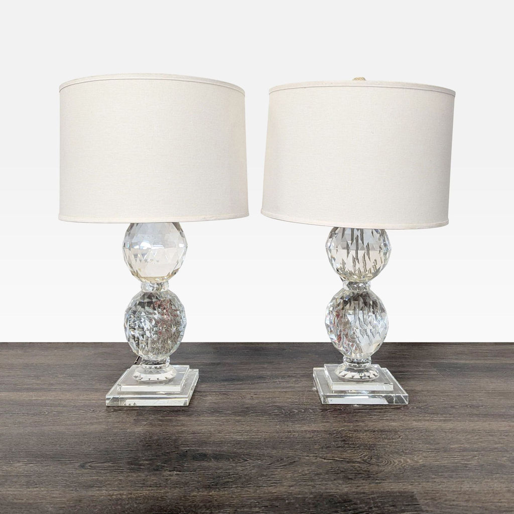 Pair of Pottery Barn crystal table lamps with white shades and square bases, ideal for versatile lighting decor.  