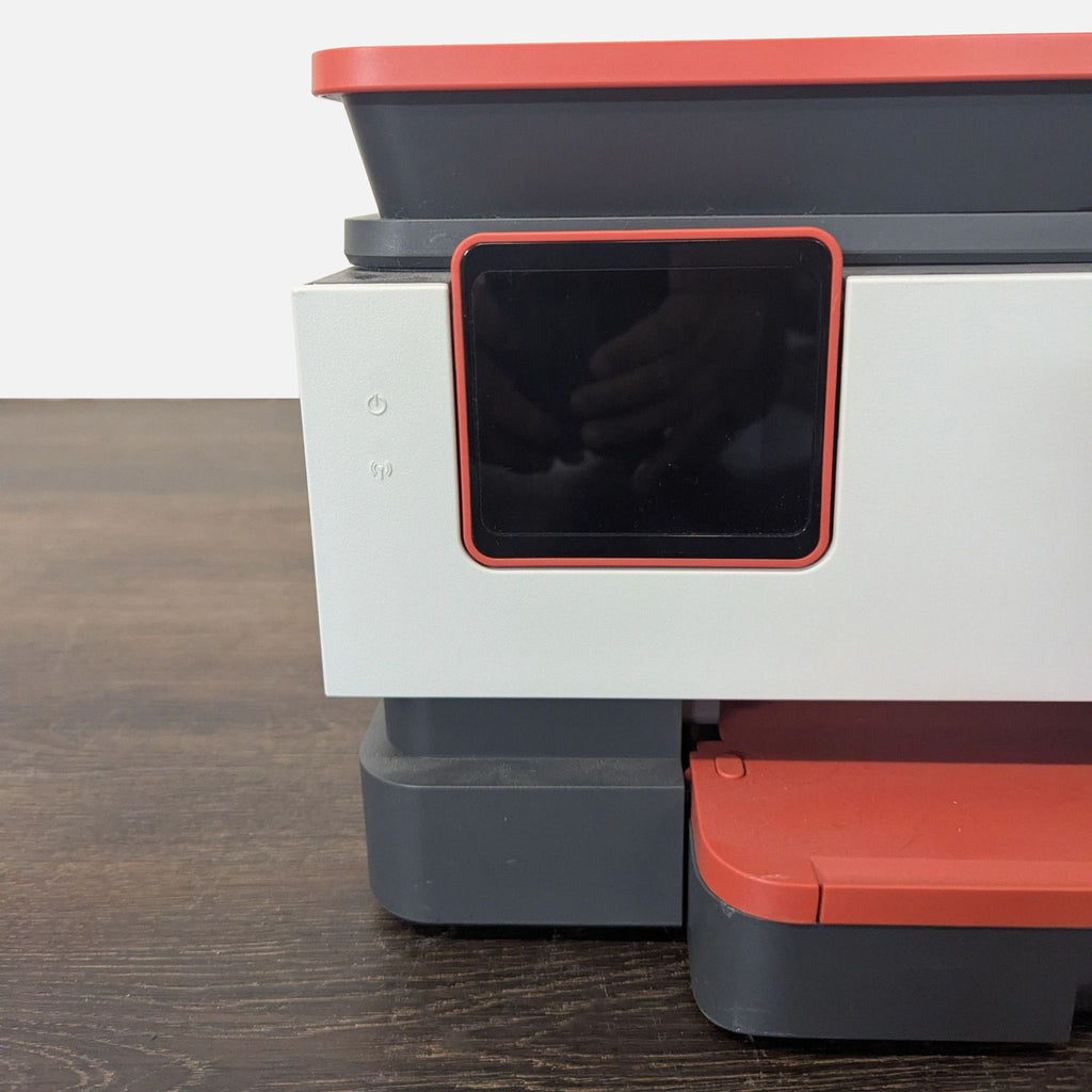 Compact HP OfficeJet Pro 8035 all-in-one printer in red and gray, ideal for home or office use.