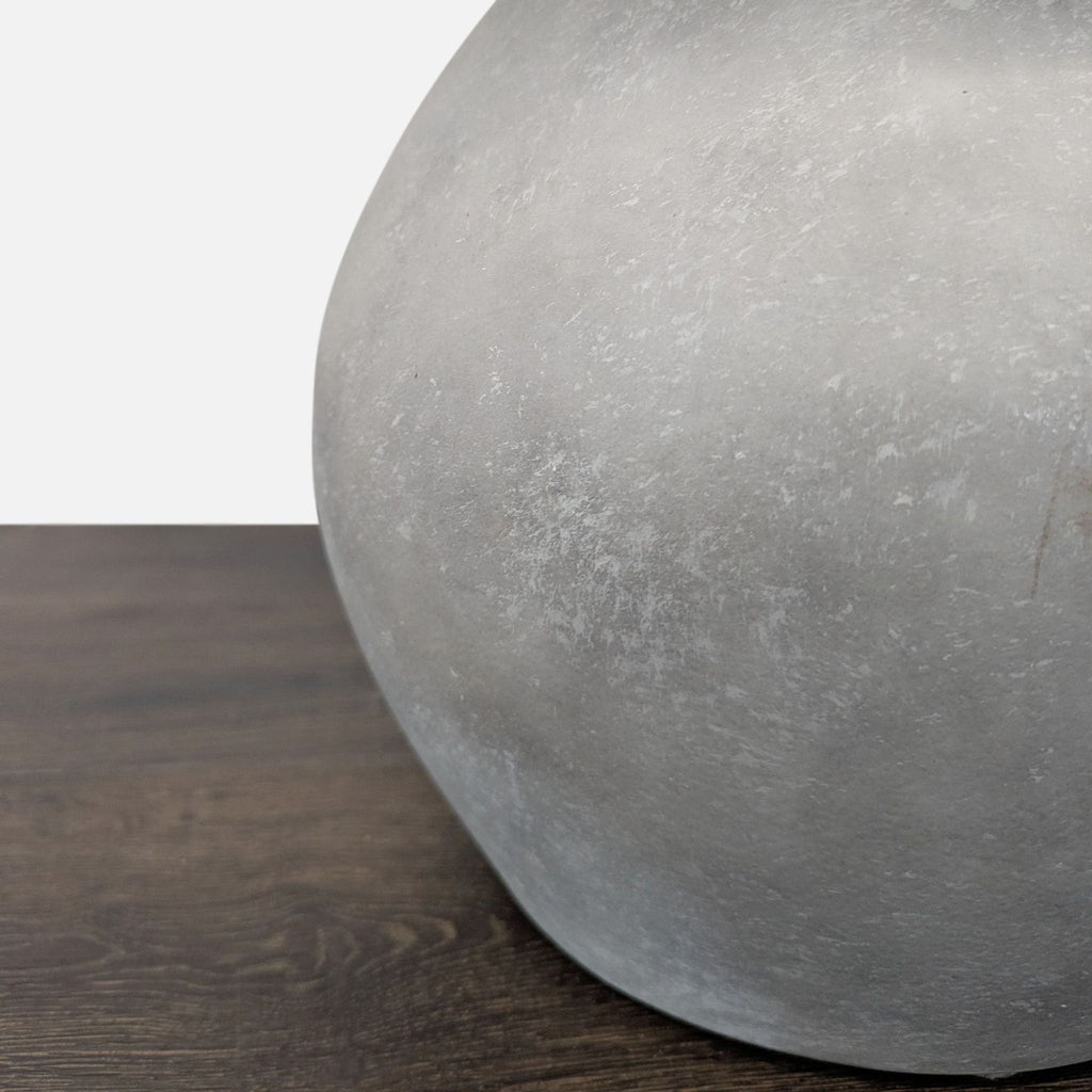 Modern table lamp by Pottery Barn featuring a textured gray base and simple white fabric shade.