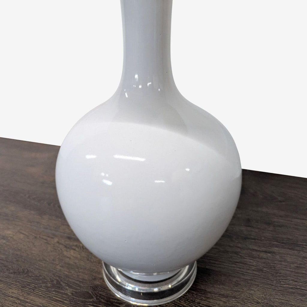 Set of Safavieh lighting: white glossy ceramic lamps with fabric shades, offering soft, ambient light.