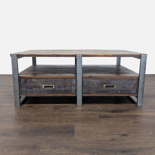 Reclaimed wood and metal coffee table featuring four drawers for storage.  