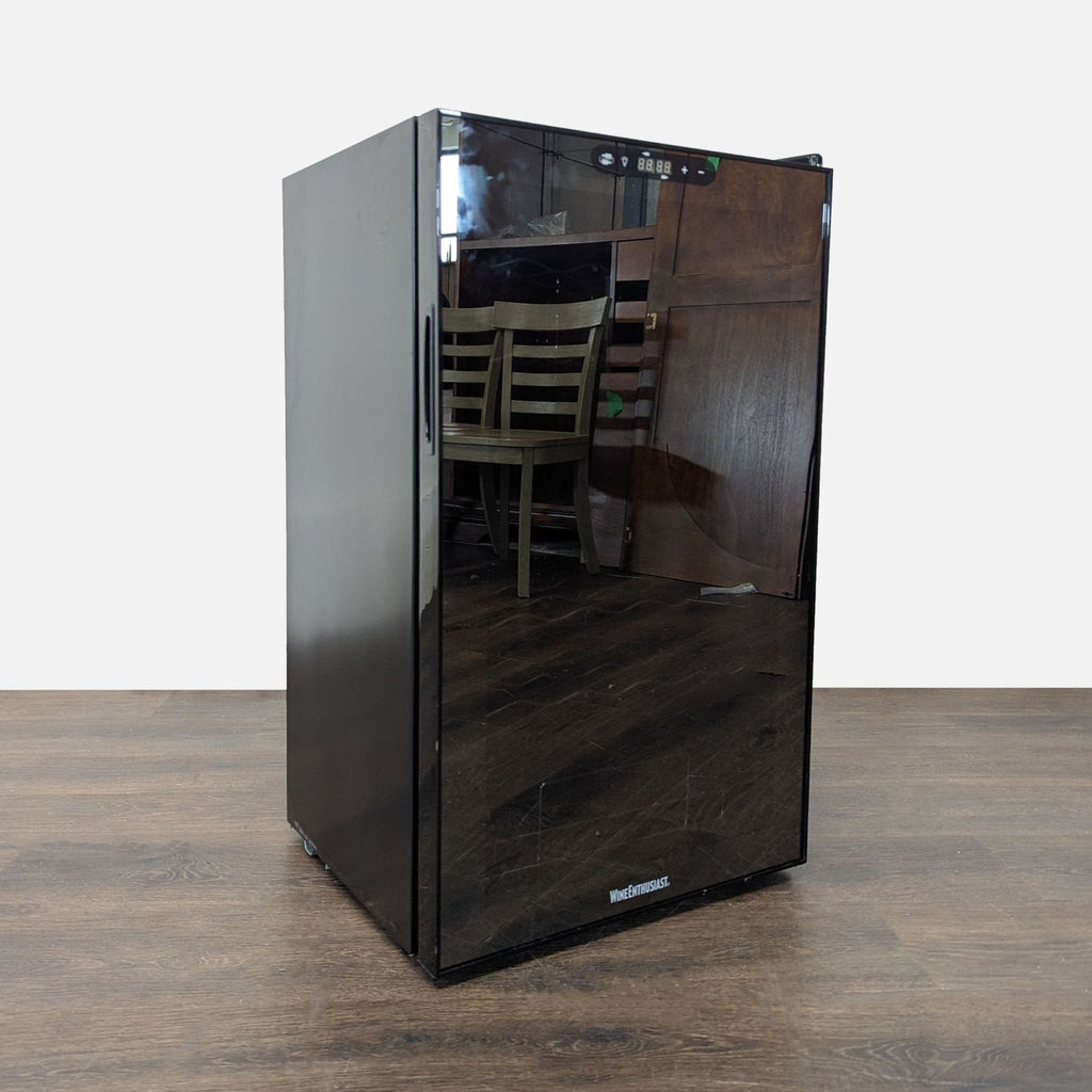 Wine Enthusiast compact refrigerator features a modern black finish, reflective glass door, and top digital display.