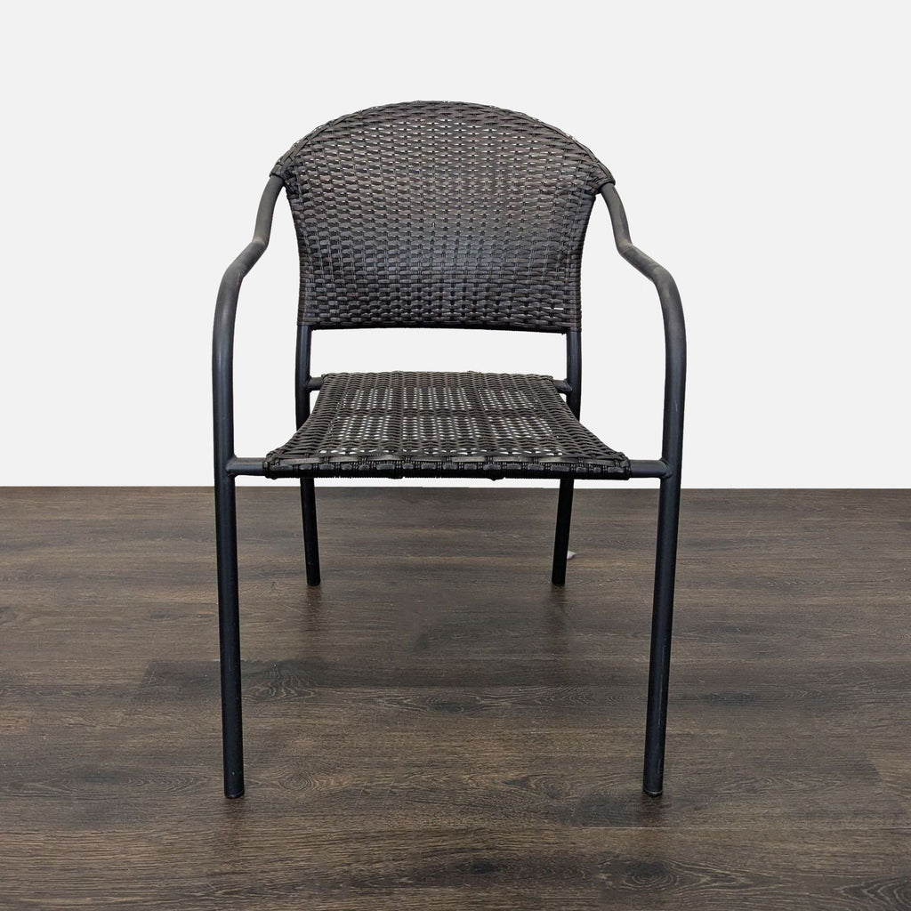 Eight matching Pelham Bay chairs featuring black woven rattan seats, sturdy metal frames, and comfortable armrests, stackable design.