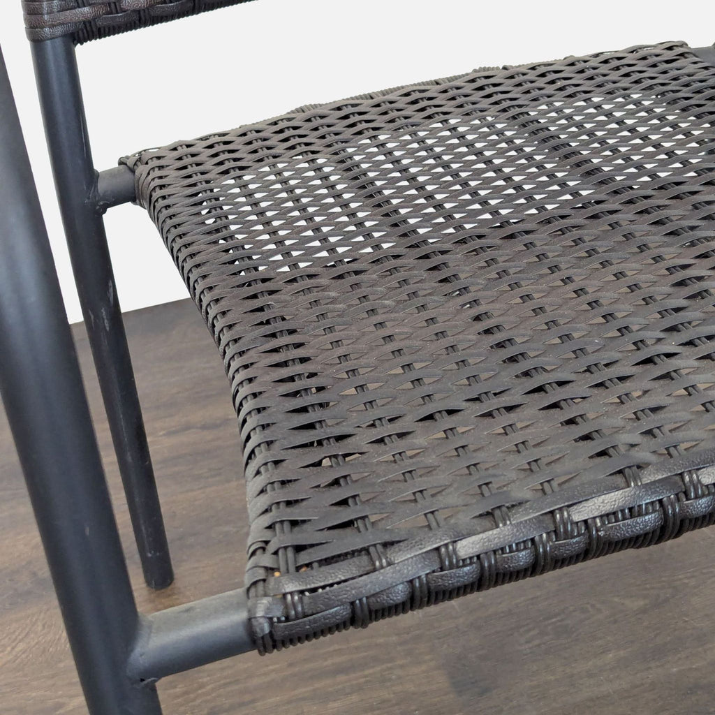 Pelham Bay all-weather rattan chairs set of 8 with black seats, metal frames, and armrests, suitable for patios or dining areas.