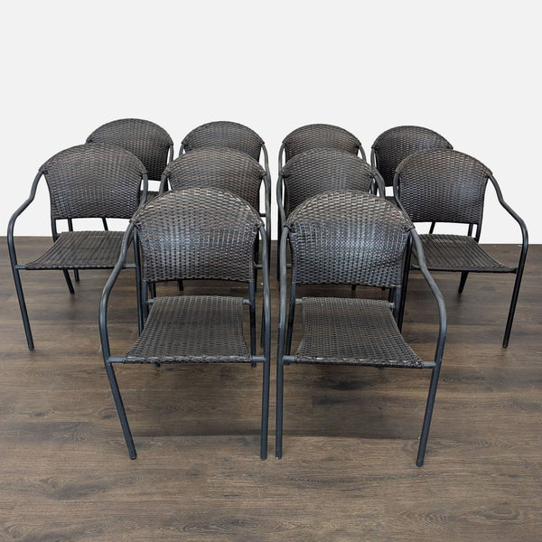 Set of 8 Pelham Bay stackable chairs with black rattan seats, metal frames, and armrests for indoor or outdoor use.