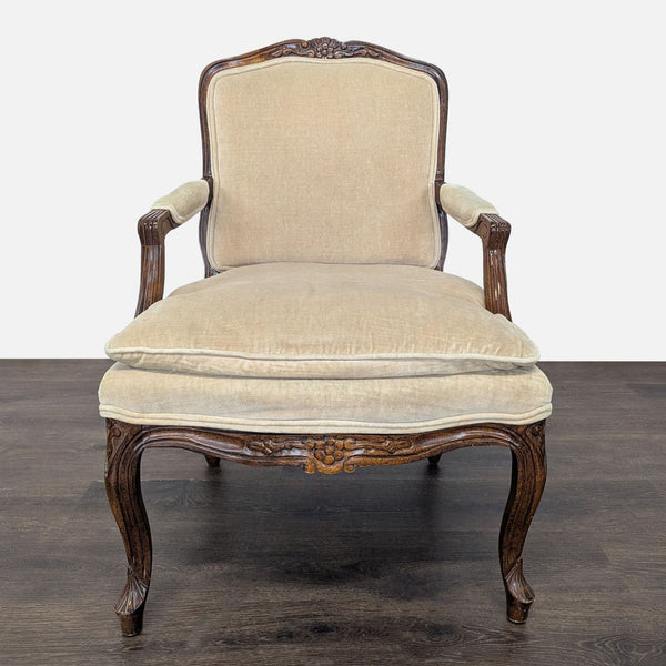 1. Vintage lounge chair with beige upholstery, plush cushion, and detailed dark wood frame, viewed from front.