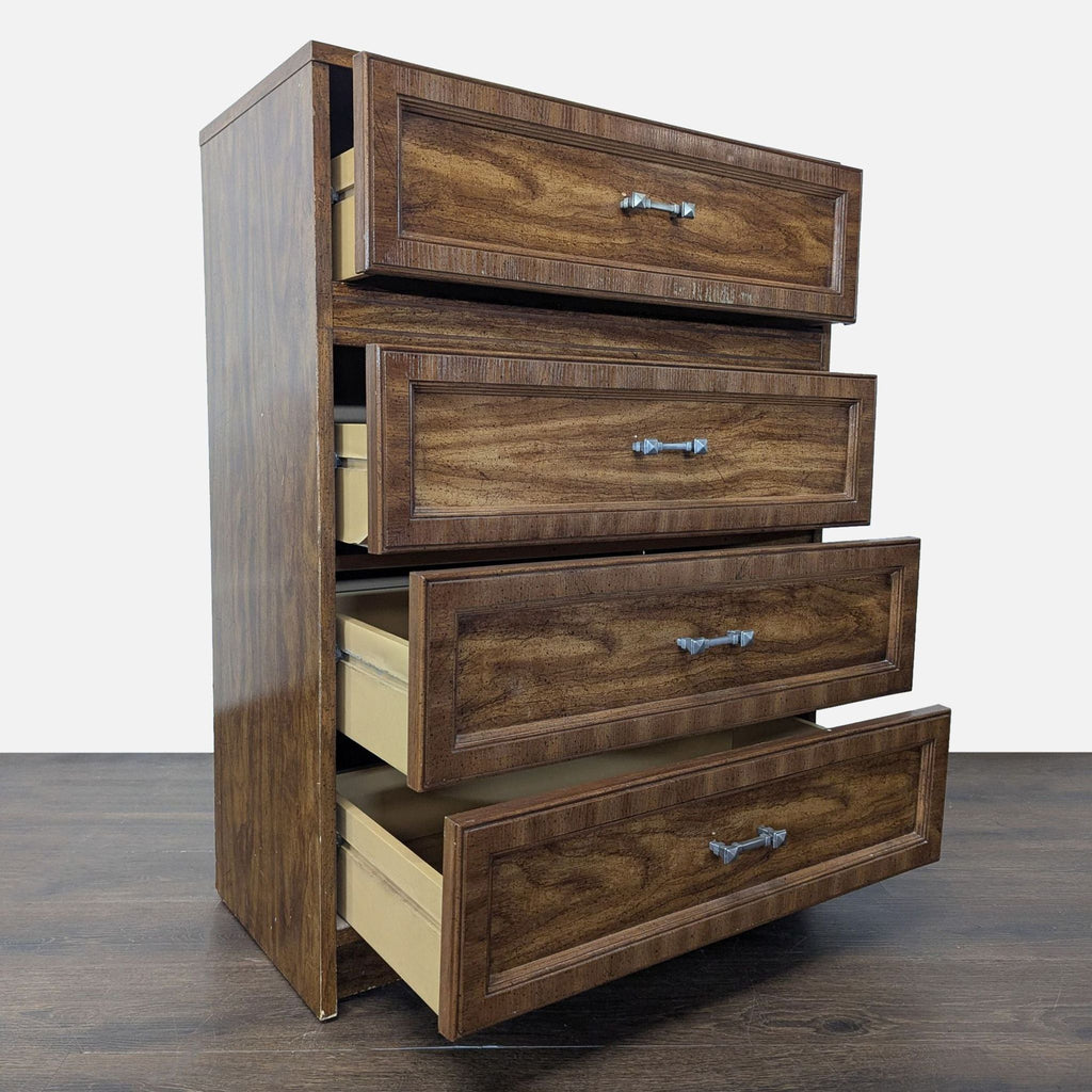 Angled view of a wooden four-drawer dresser with all drawers partially open, showing spacious storage.