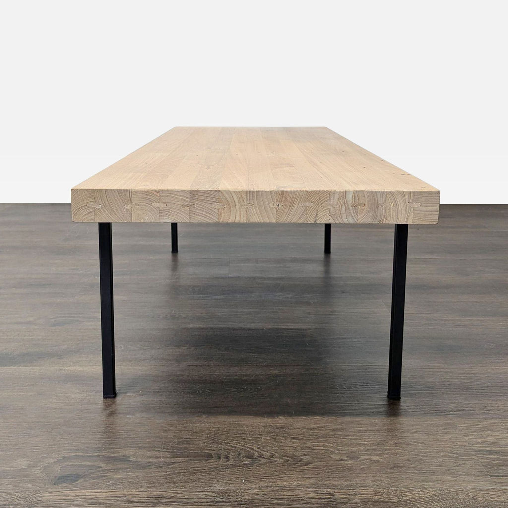 2. Sturdy EQ3 rectangular table featuring a thick wood surface and slim black metal legs, perfect for daily use.  