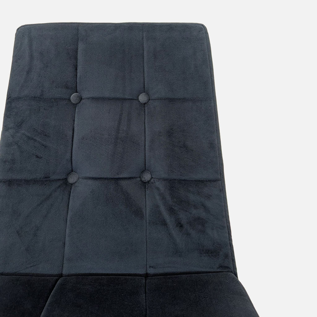 Button tufted chair designed by Jannis Ellenberger, featuring a contemporary metal cantilever base.