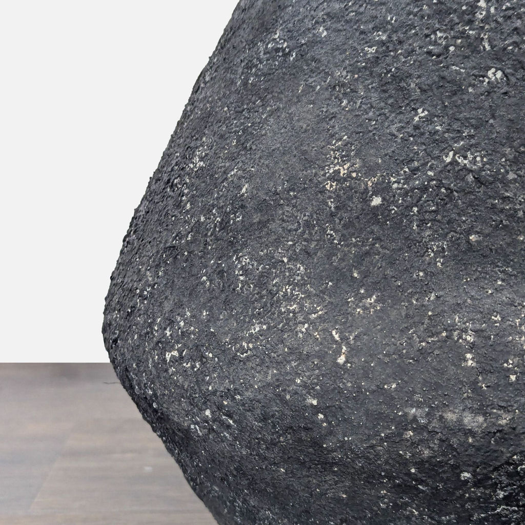 Close-up of the Troy Lighting lamp’s textured black geometric base, highlighting its unique surface detail.  