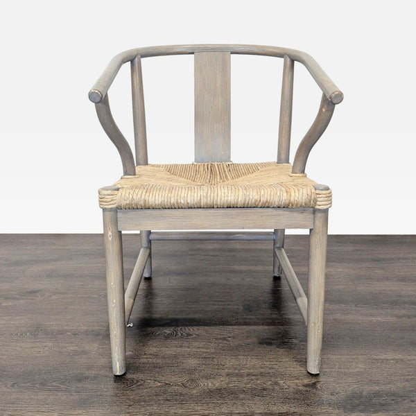 1. Front view of a Hans Wegner Wishbone-inspired dining chair with a curved wooden frame and woven seat.  