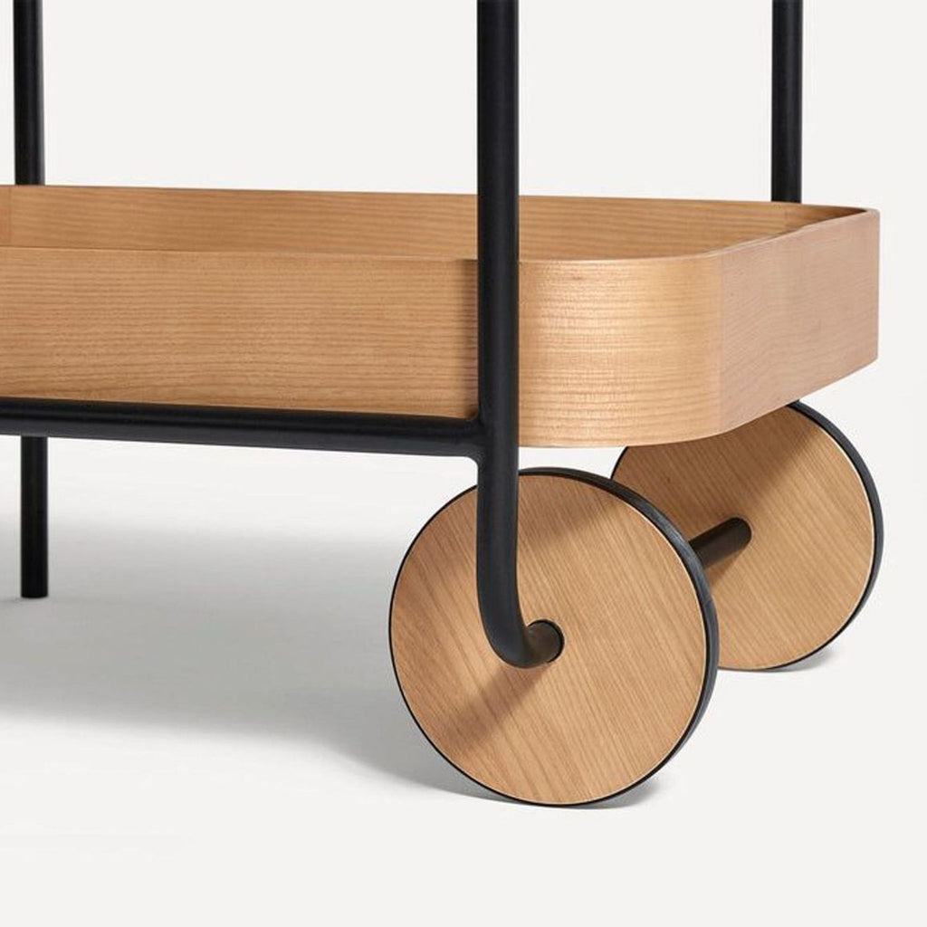 Modern oak and metal cart by Burrow, versatile for various uses, shown with minimalist style.  