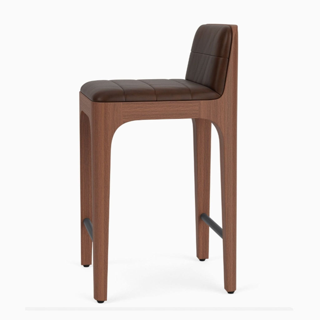 Channel-tufted leather and cane accent chair in walnut finish maple by Denver Modern.  