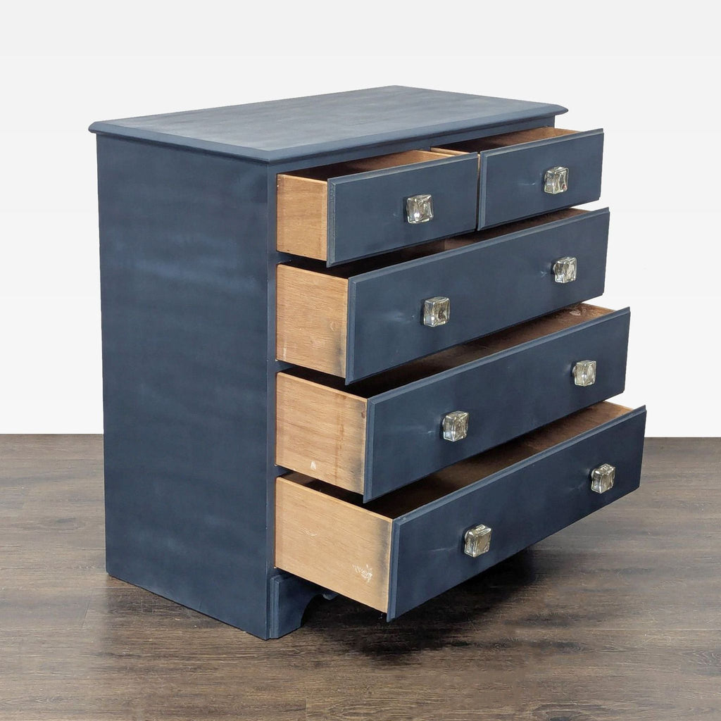 Blue dresser featuring two small top drawers, three large bottom drawers, and sparkling crystal knobs.