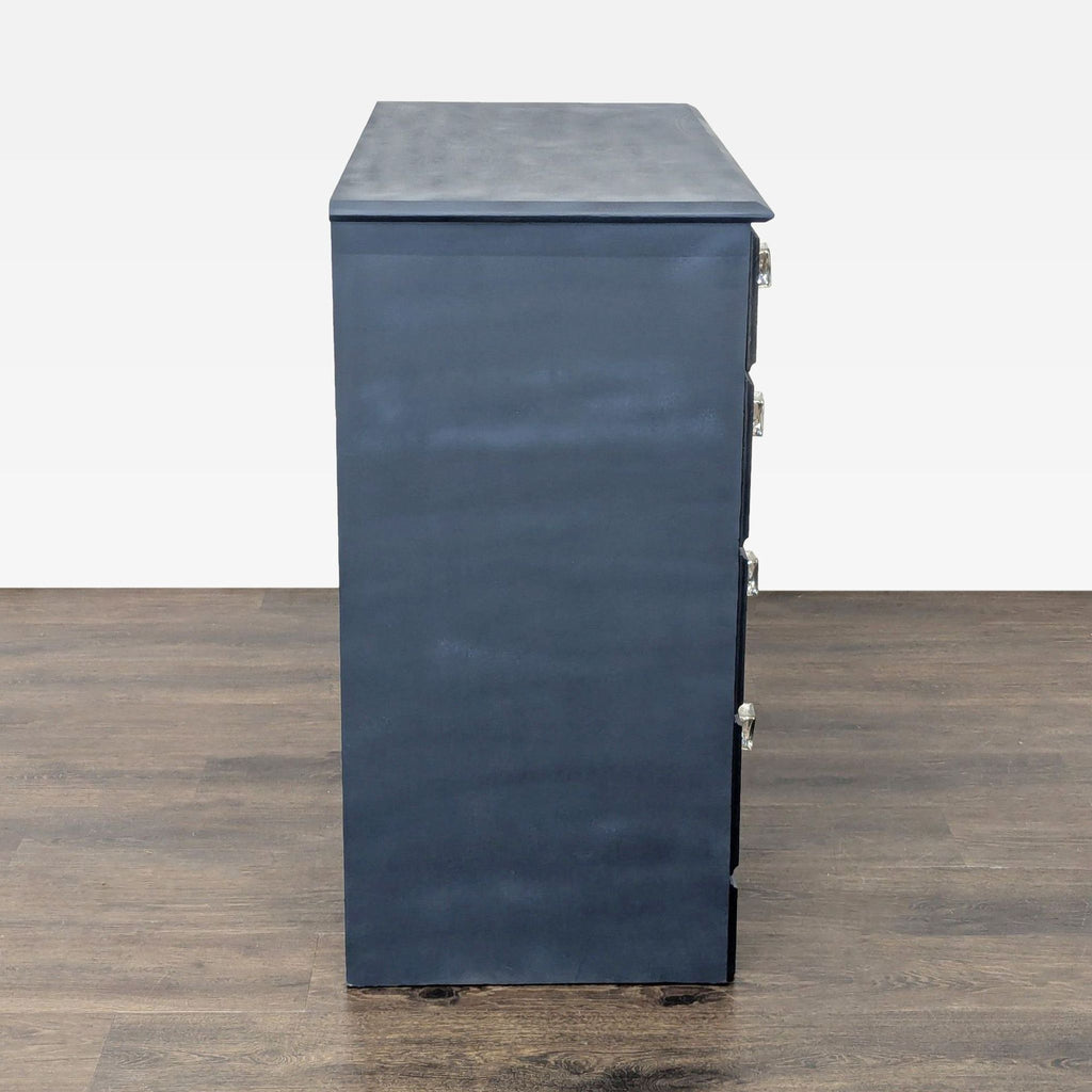 Classic five-drawer navy dresser with sparkling knobs, ideal for organizing clothes and essentials.