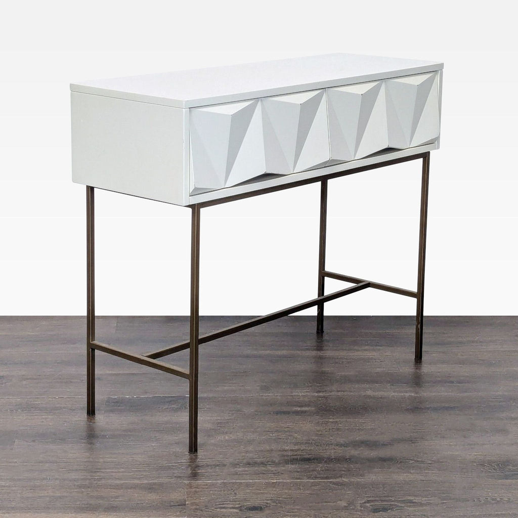 Modern console table with brushed metal parchment drawer fronts and antique brass legs, by West Elm.