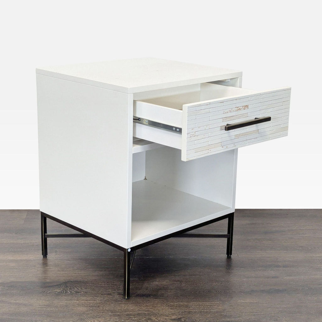 Modern nightstand by West Elm featuring lacquered finish and geometric tile pattern on the drawer.