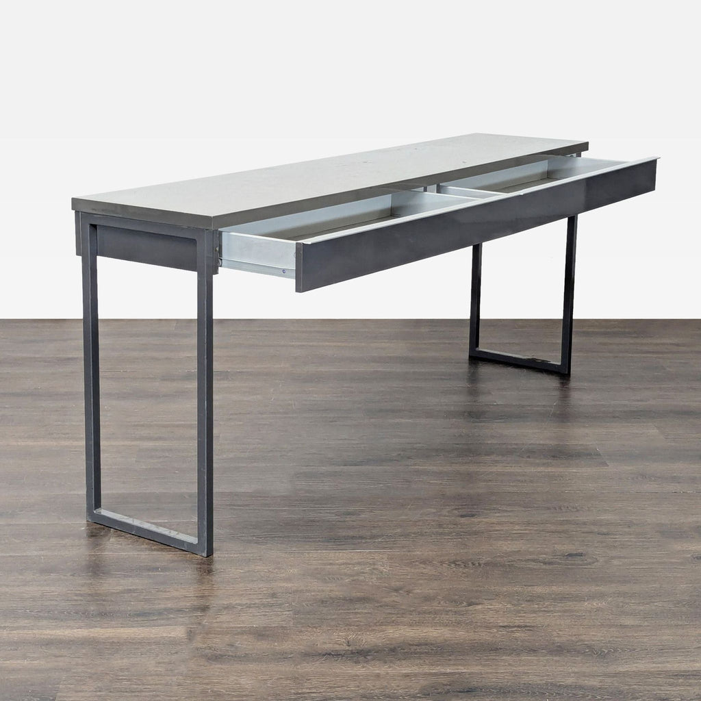 Simple gray Ikea desk featuring two spacious drawers and a sturdy frame, great for workspace organization.
