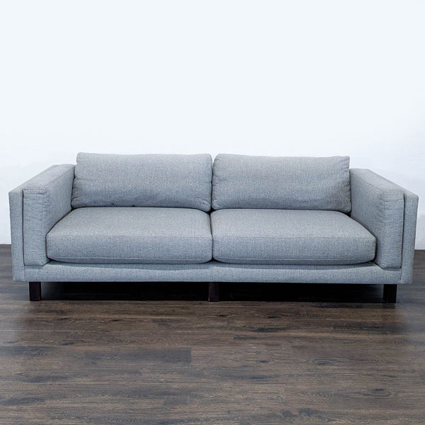 Room and Board 3-seat sofa with plush gray fabric, clean lines, and sturdy dark wood legs.