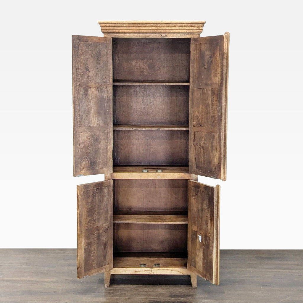 Wooden cabinet in natural finish, displaying four panel doors and shelving inside.