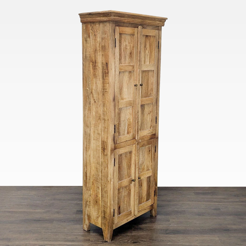 Front view of a natural wood cabinet, featuring interior shelves behind four panels.