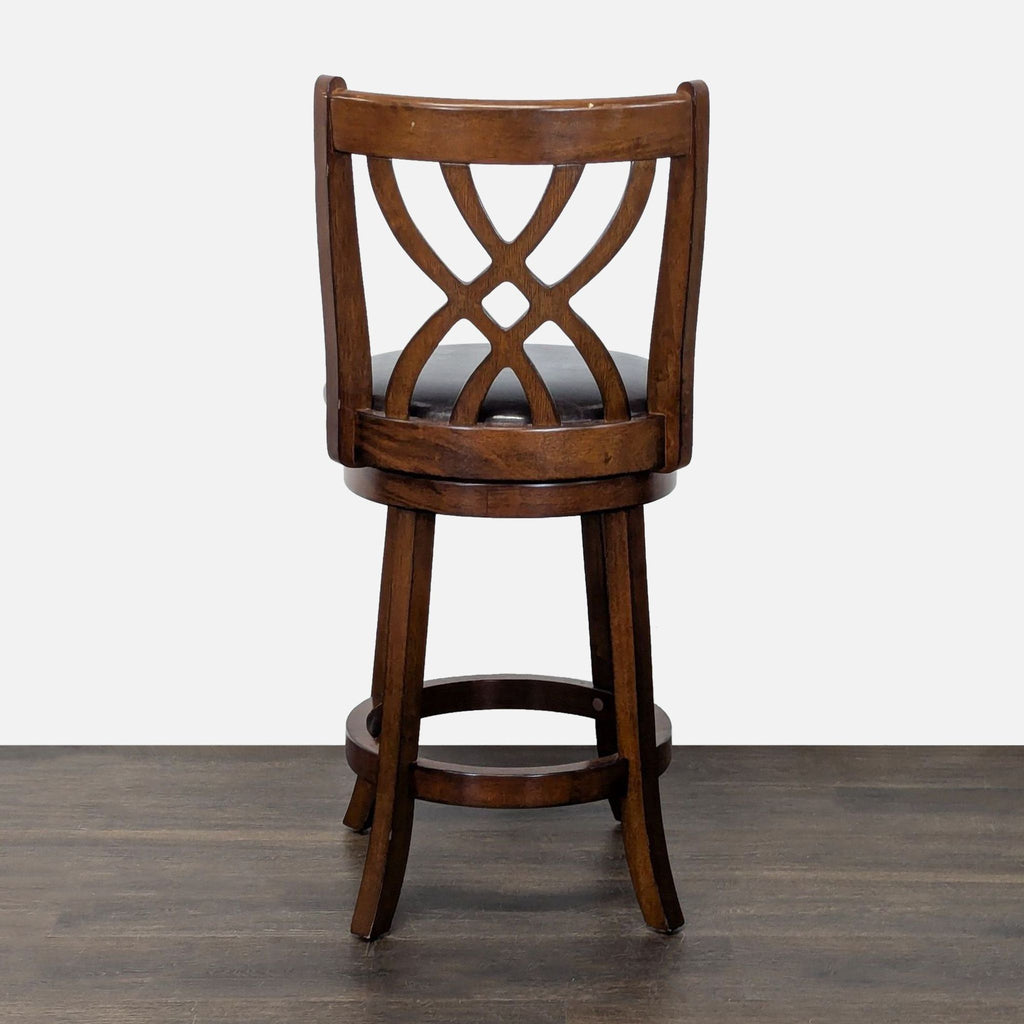 1. Wooden bar stool with an intricate curved backrest and round cushioned seat, shown on a wooden floor.