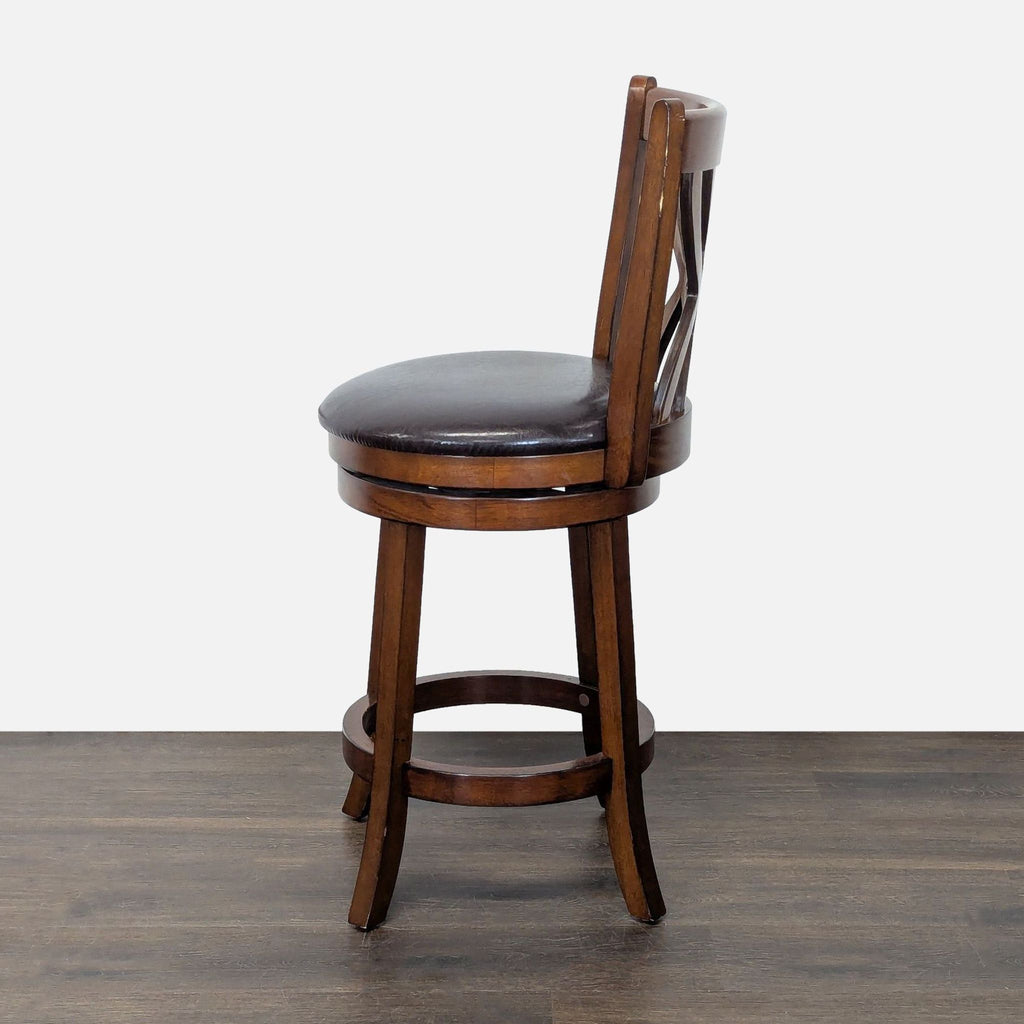 2. Side view of a Costway/Pier 1 bar stool featuring a padded seat and decorative wood back, on dark flooring.