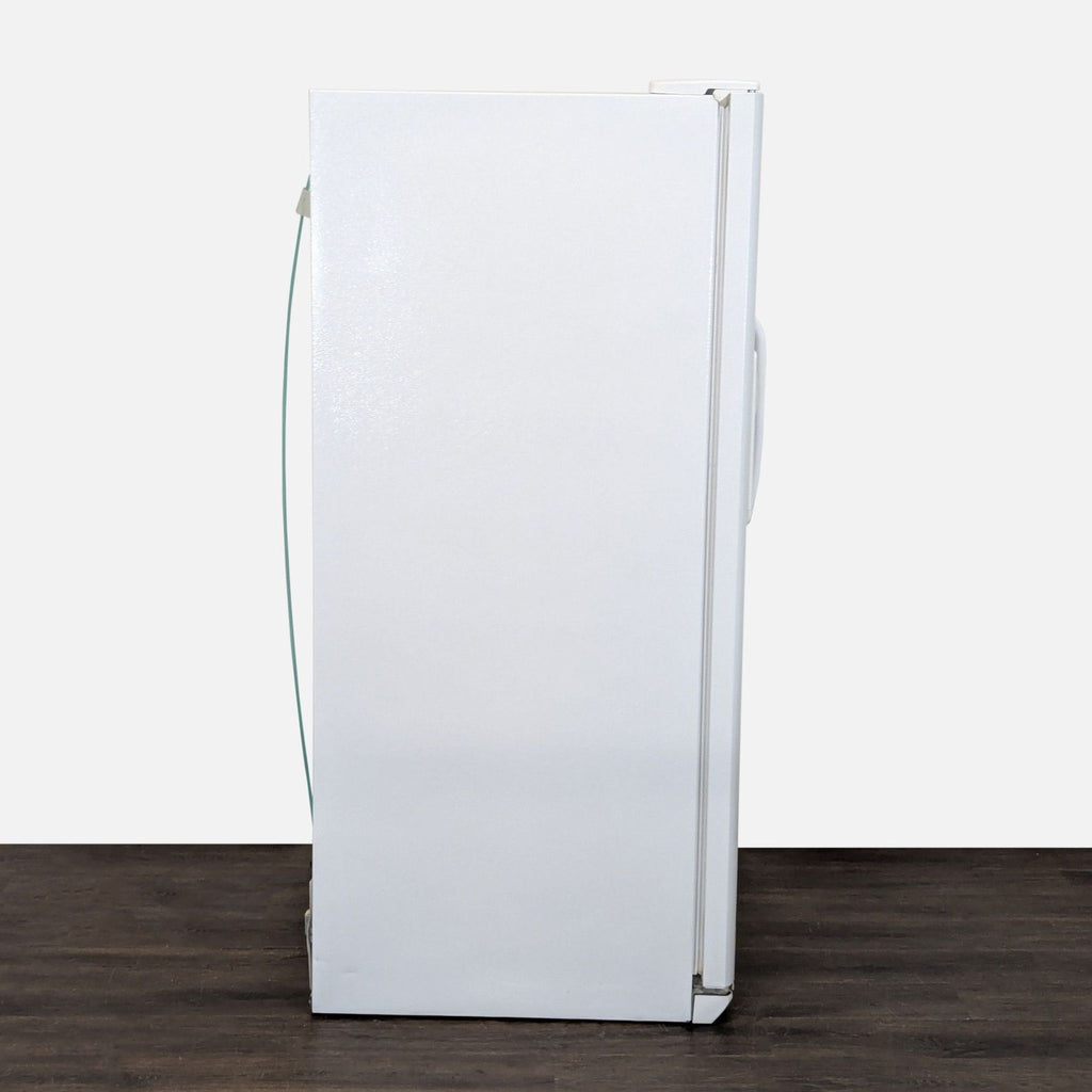 White Frigidaire refrigerator with side-by-side doors, clean finish, and convenient ice and water access.