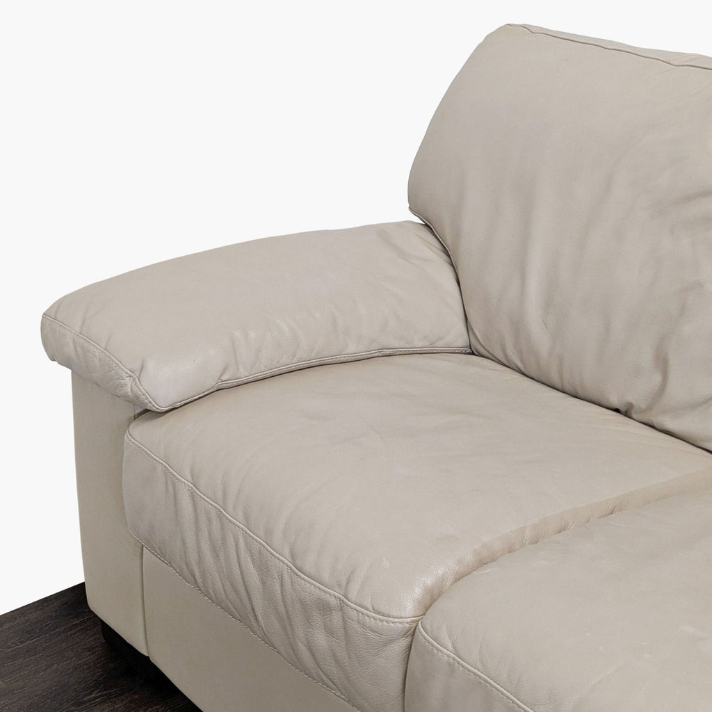 Italsofa brand 3-seat beige leather sofa featuring soft cushions and durable wide armrests for home or office.