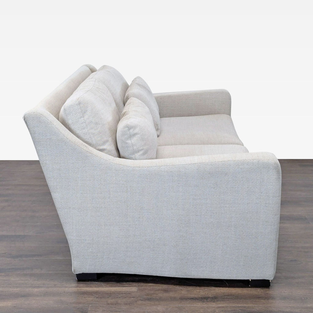 Crate and Barrel three-seater sofa featuring soft upholstery, clean lines, and sturdy construction for living rooms.