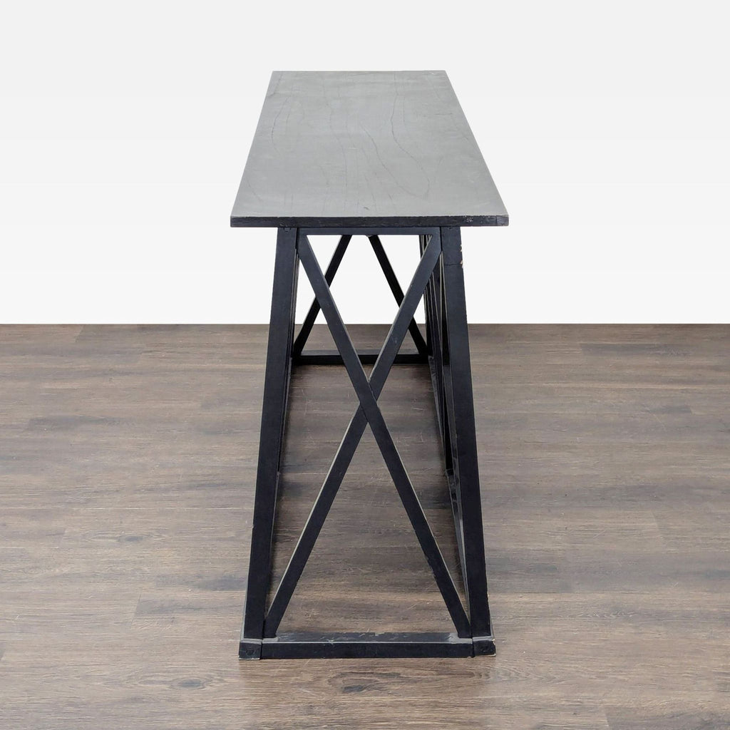 2. Side view of a Target side table featuring a rectangular top and bold, X-style open frame.