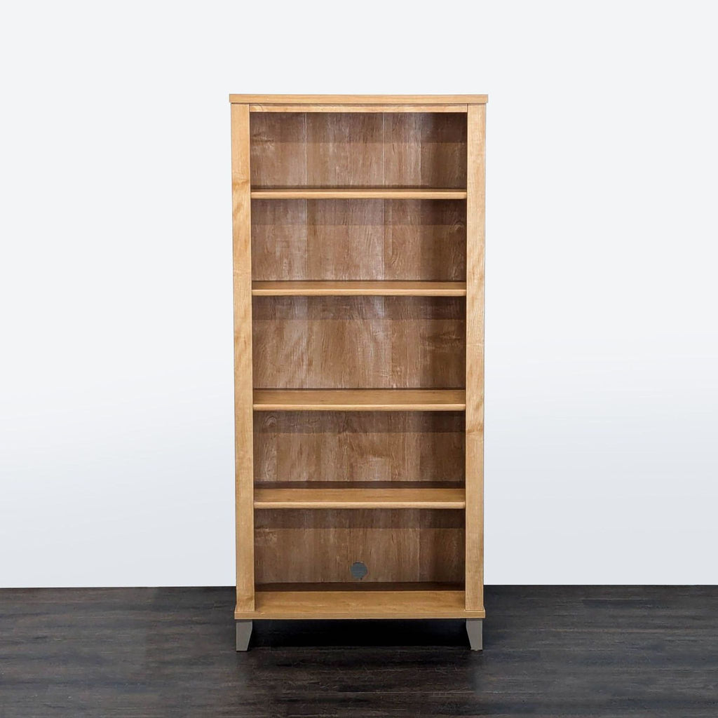 1. Tall wooden bookshelf with five shelves, displaying books and decor, by Bush Furniture.  