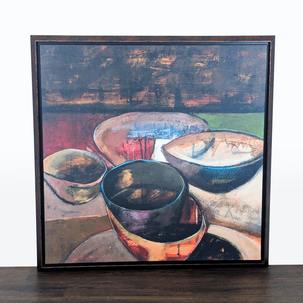 1. Framed abstract print of colorful bowls with bold, textured details, great for modern home or office décor.