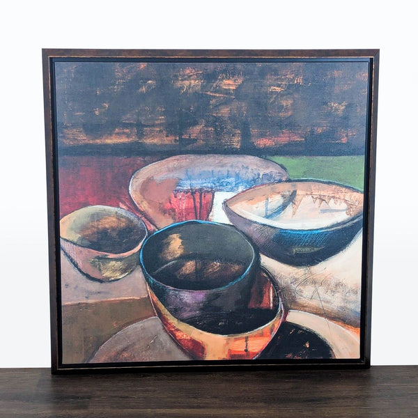 1. Framed abstract print of colorful bowls with bold, textured details, great for modern home or office décor.